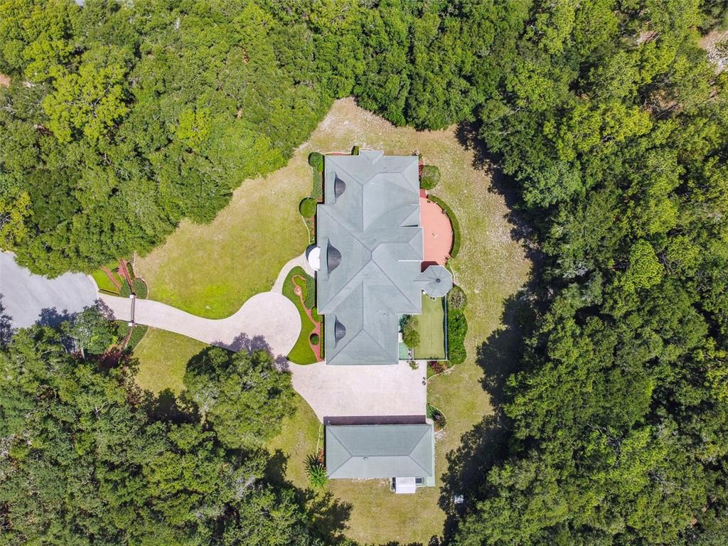 1745 Taylor Woods Road DeLand, FL 32724 - Photo 6 of 66 an aerial view of a house with a yard and swimming pool