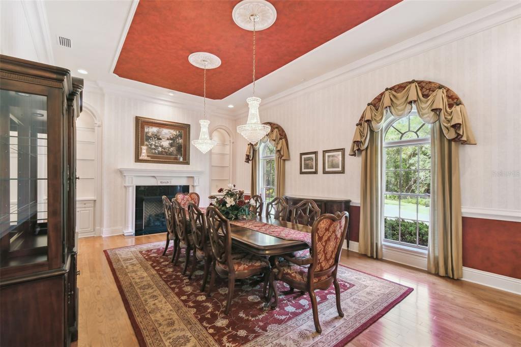 1745 Taylor Woods Road DeLand, FL 32724 - Photo 8 of 66 a dining room with furniture a fireplace and wooden floor