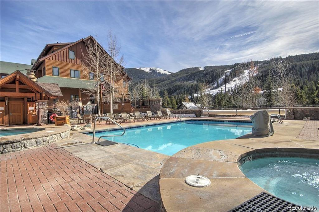 82 Wolf Rock Road Keystone, CO 80435 - Photo 14 of 26 a view of a house with pool and chairs