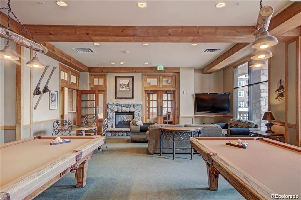 82 Wolf Rock Road Keystone, CO 80435 - Photo 16 of 26 a living room with furniture and a flat screen tv