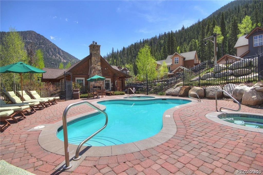 82 Wolf Rock Road Keystone, CO 80435 - Photo 21 of 26 a swimming pool with outdoor seating yard and barbeque oven