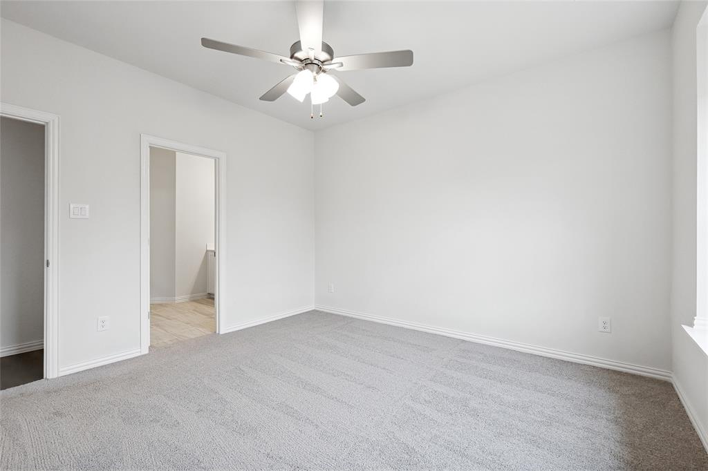 3900 Coco Lane Sherman, TX 75090 - Photo 10 of 40 Unfurnished room with ceiling fan and light colored carpet