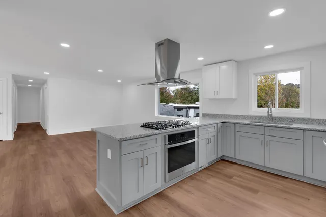 a kitchen with a stove and a sink
