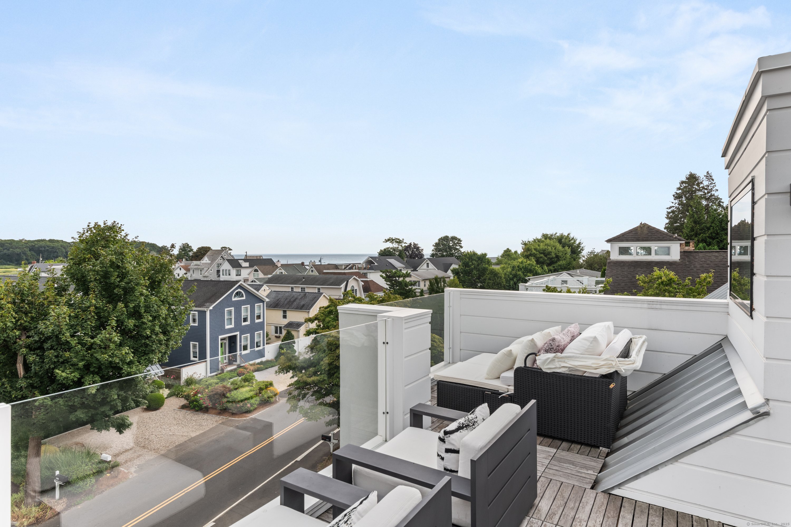 200 Hillspoint Road Westport, CT 06880 - Photo 32 of 37 a view of a terrace with couches and a table