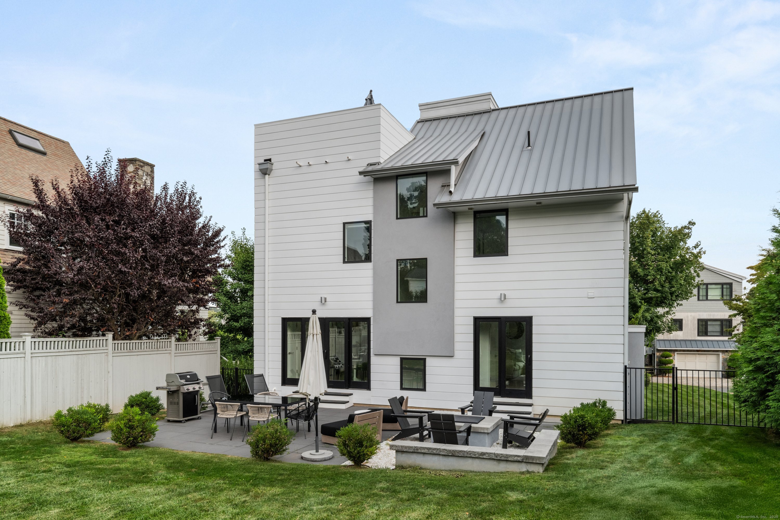 200 Hillspoint Road Westport, CT 06880 - Photo 36 of 37 a view of a house with backyard and sitting area