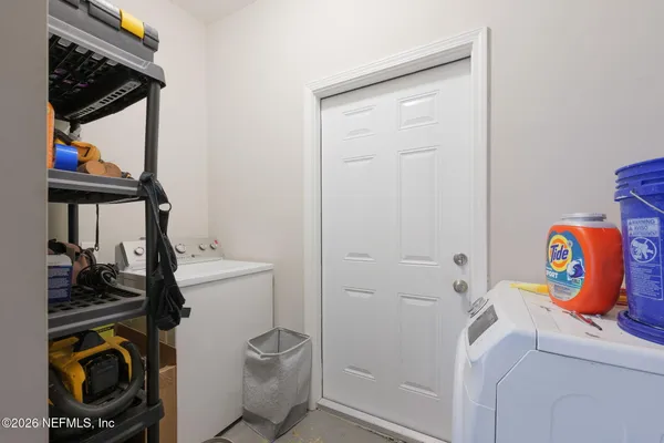 a view of hallway with wooden floor