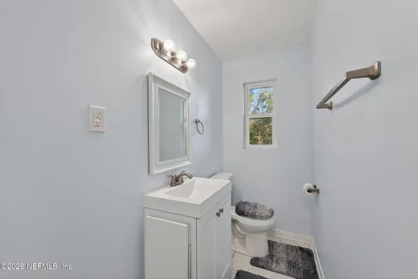 a bedroom with bed and a window