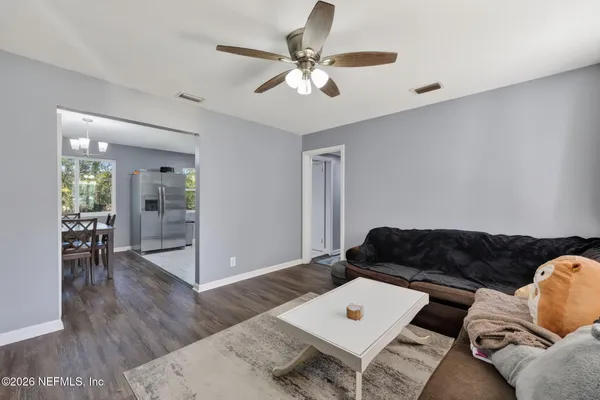 a living room with furniture and a large window