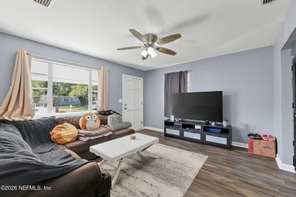 a kitchen with stainless steel appliances a stove a microwave and a sink