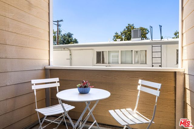 a view of a room with furniture and window