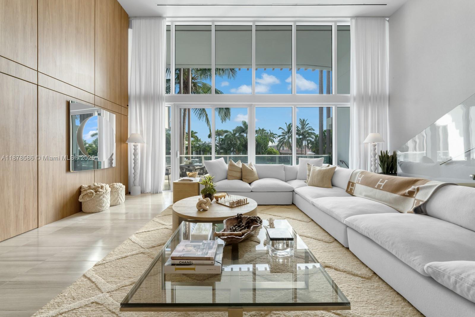 4701 Meridian Avenue, Unit 222 Miami Beach, FL 33140 - Photo 1 of 44 a living room with furniture and a large window