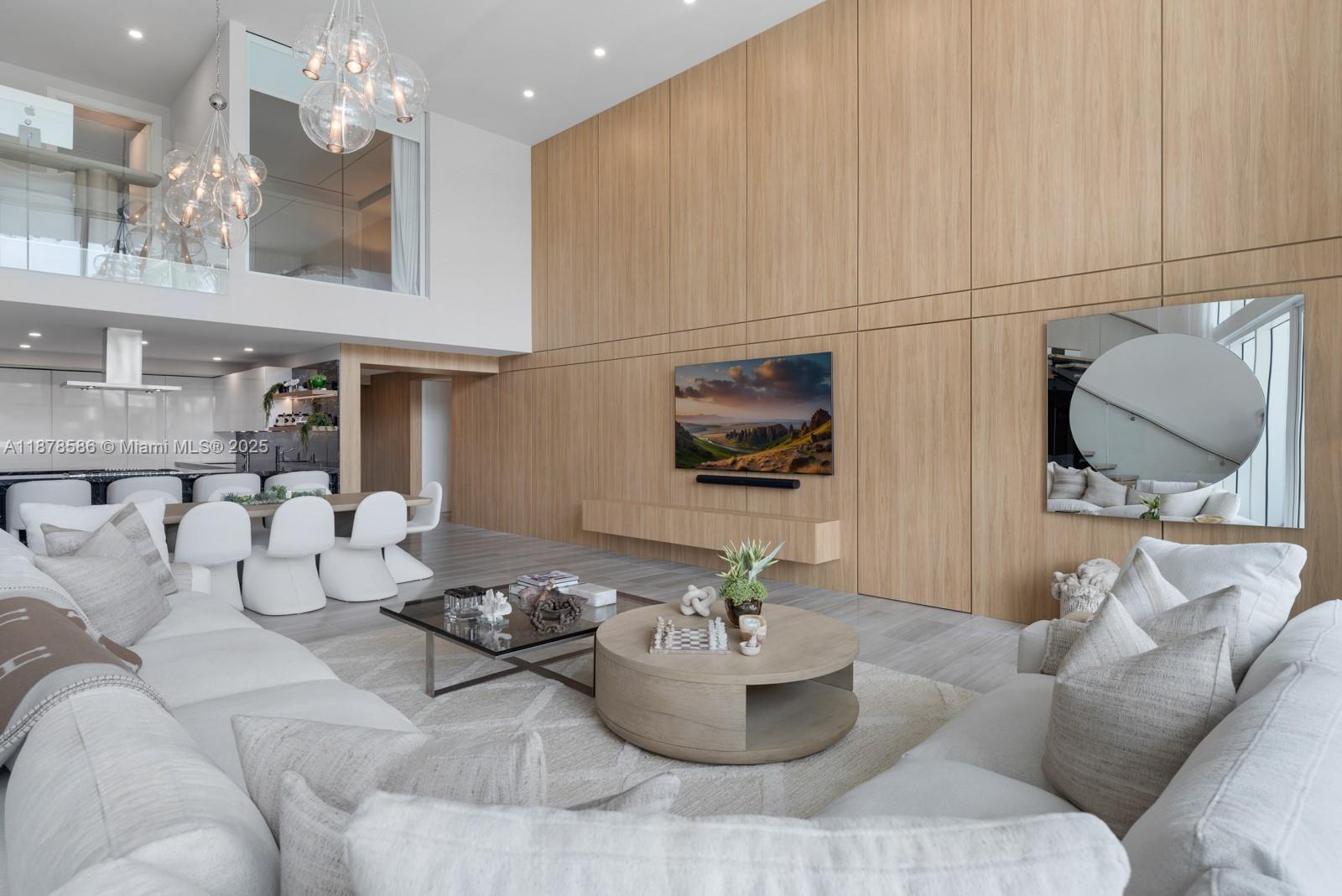 4701 Meridian Avenue, Unit 222 Miami Beach, FL 33140 - Photo 18 of 44 a living room with furniture and a flat screen tv