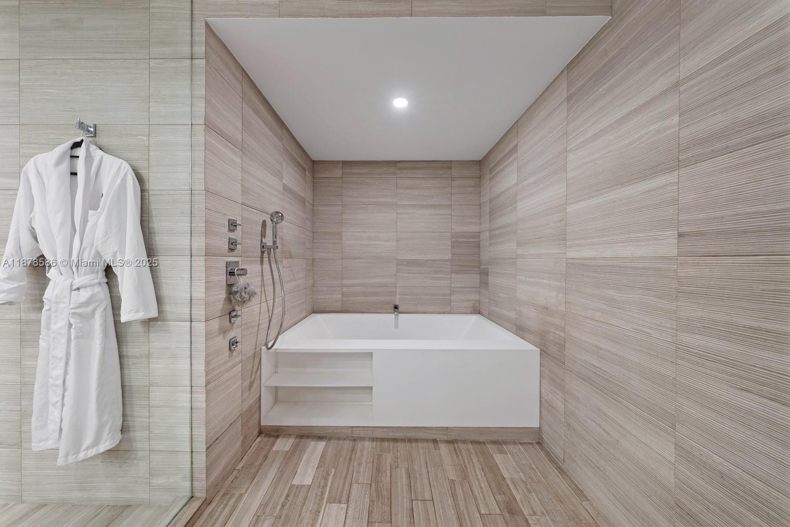 4701 Meridian Avenue, Unit 222 Miami Beach, FL 33140 - Photo 24 of 44 a bathroom with a sink and a shower