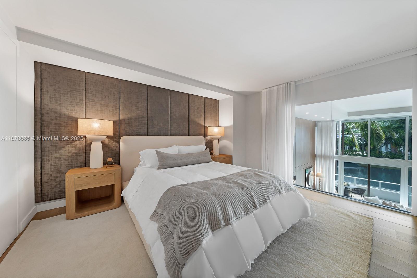 4701 Meridian Avenue, Unit 222 Miami Beach, FL 33140 - Photo 26 of 44 a bedroom with bed and large window