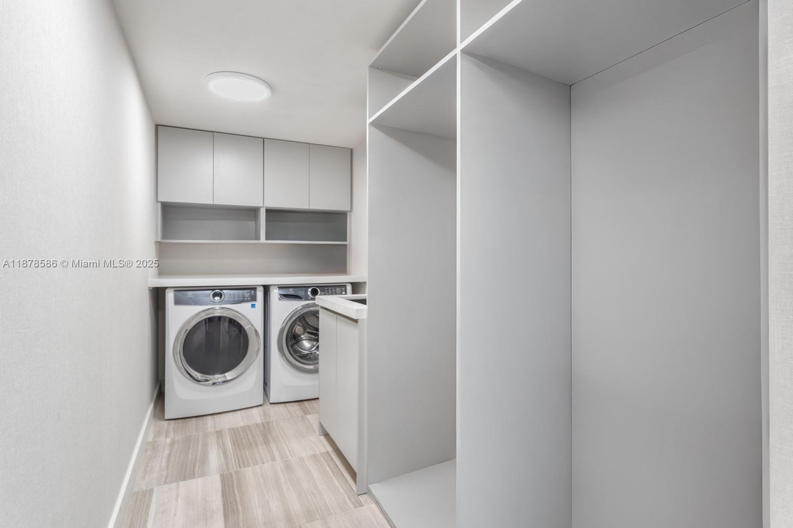 4701 Meridian Avenue, Unit 222 Miami Beach, FL 33140 - Photo 30 of 44 a utility room with washing machine and a sink