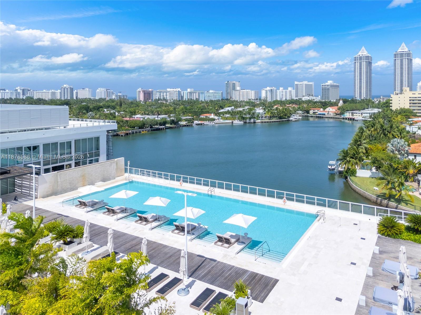 4701 Meridian Avenue, Unit 222 Miami Beach, FL 33140 - Photo 36 of 44 a view of a lake with a city skyline in the background