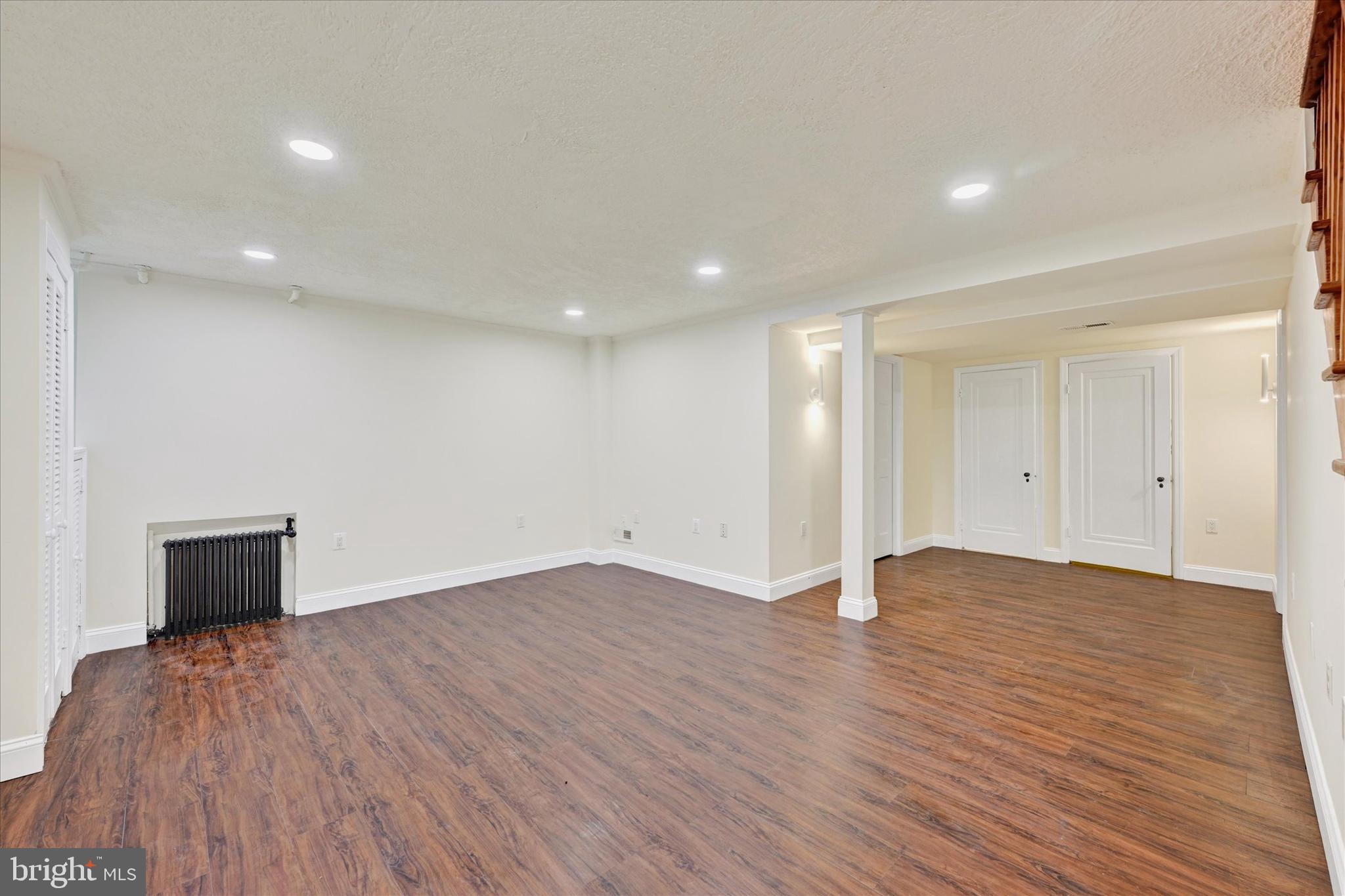 215 Regester Avenue Baltimore, MD 21212 - Photo 18 of 24 a view of an empty room with wooden floor and closet