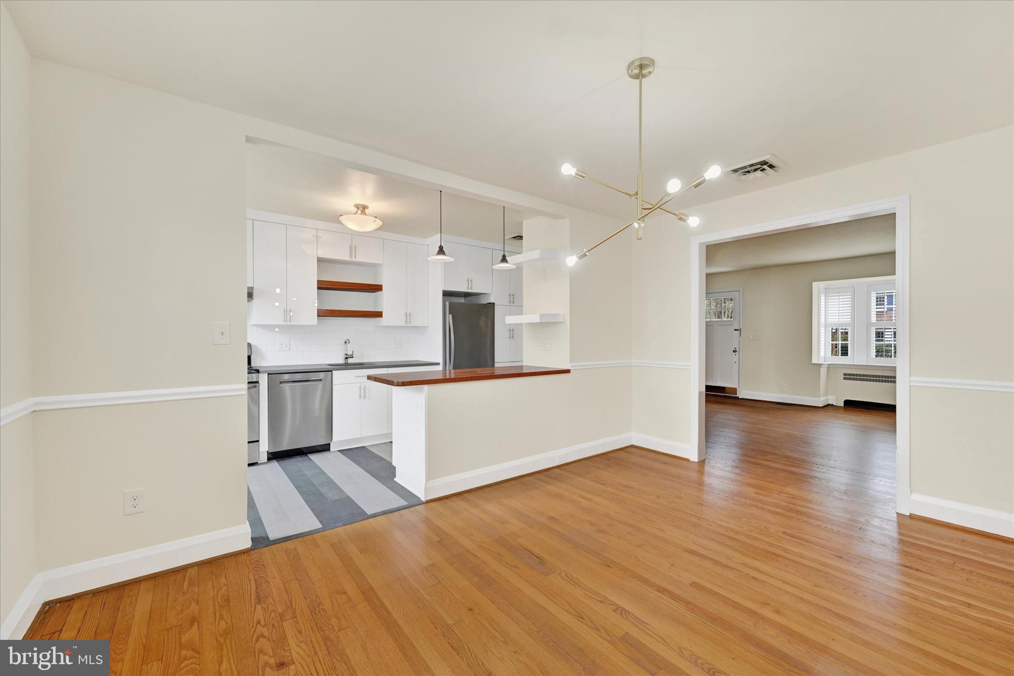215 Regester Avenue Baltimore, MD 21212 - Photo 8 of 24 a large kitchen with cabinets a sink and appliances