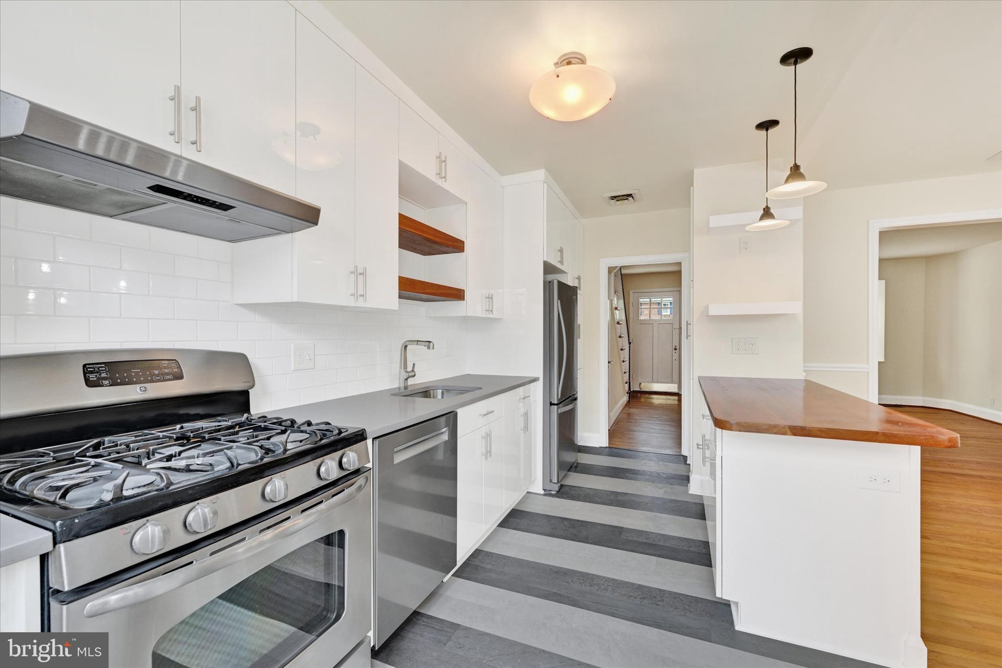 215 Regester Avenue Baltimore, MD 21212 - Photo 10 of 24 a kitchen with stove and cabinets