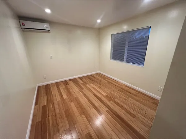a view of room with wooden floor
