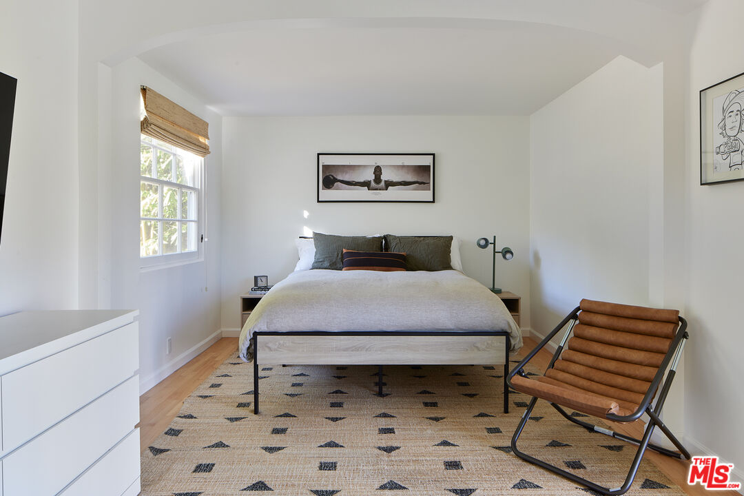 6637 Zumirez Drive Malibu, CA 90265 - Photo 11 of 29 a bedroom with a bed and a window