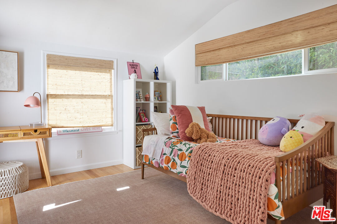 6637 Zumirez Drive Malibu, CA 90265 - Photo 14 of 29 a bed room with a bed and a chair