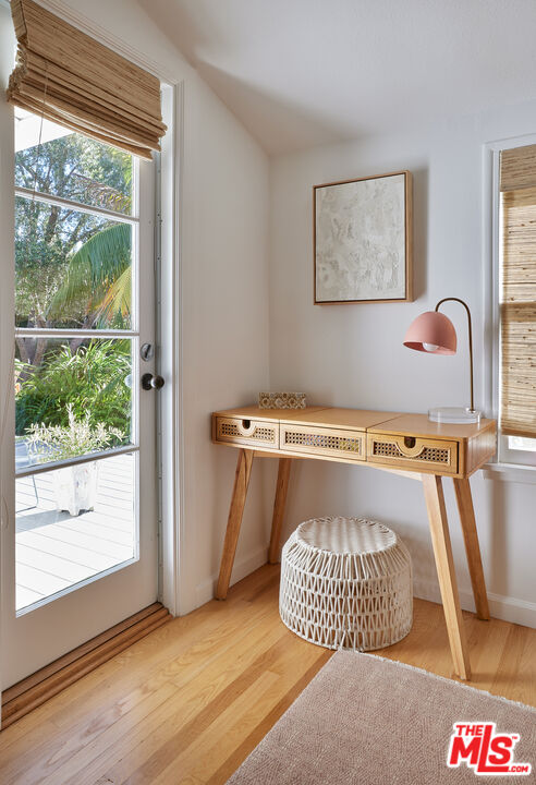 6637 Zumirez Drive Malibu, CA 90265 - Photo 15 of 29 a room with a door and wooden floor