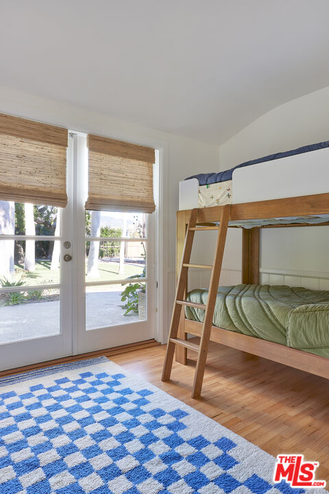 6637 Zumirez Drive Malibu, CA 90265 - Photo 17 of 29 a bedroom with a bed and a window