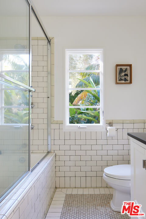 6637 Zumirez Drive Malibu, CA 90265 - Photo 19 of 29 a bathroom with a toilet a sink and a shower