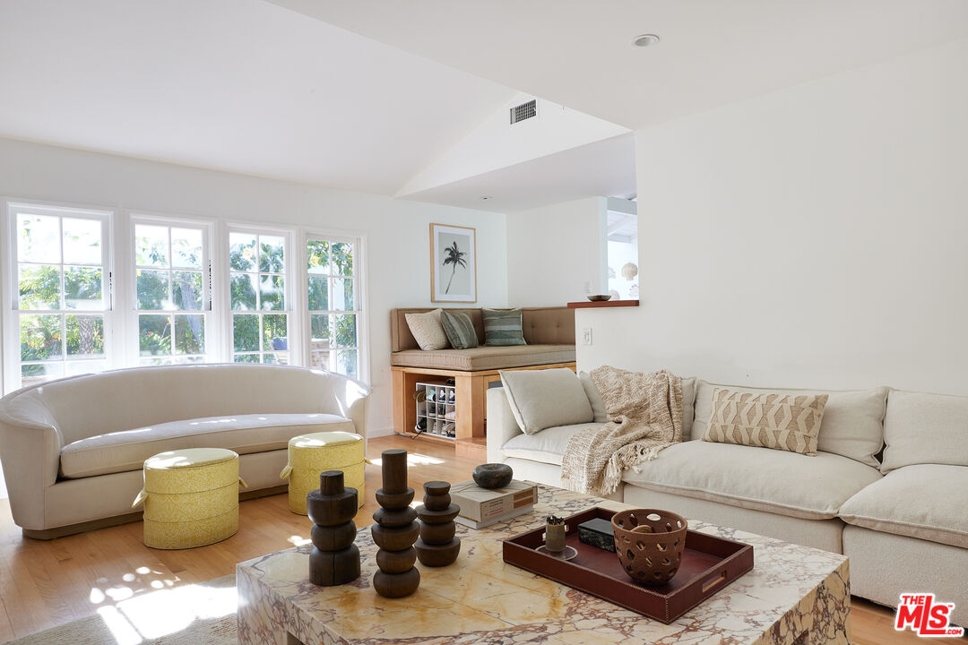 6637 Zumirez Drive Malibu, CA 90265 - Photo 21 of 29 a living room with furniture and a couch