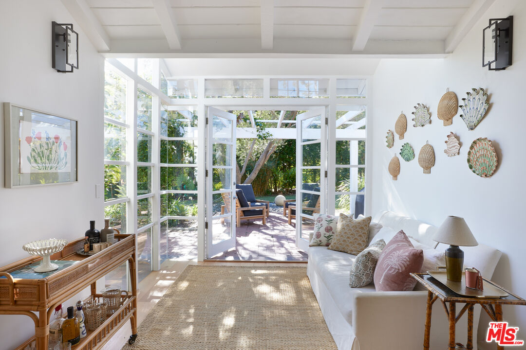 6637 Zumirez Drive Malibu, CA 90265 - Photo 4 of 29 a living room with furniture and a large window