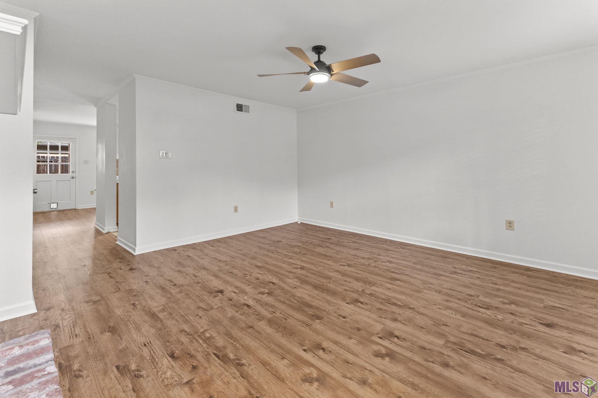 9007 Highland Road, Unit 18 Baton Rouge, LA 70810 - Photo 6 of 22 Living Room looking toward Dining and Kitchen
