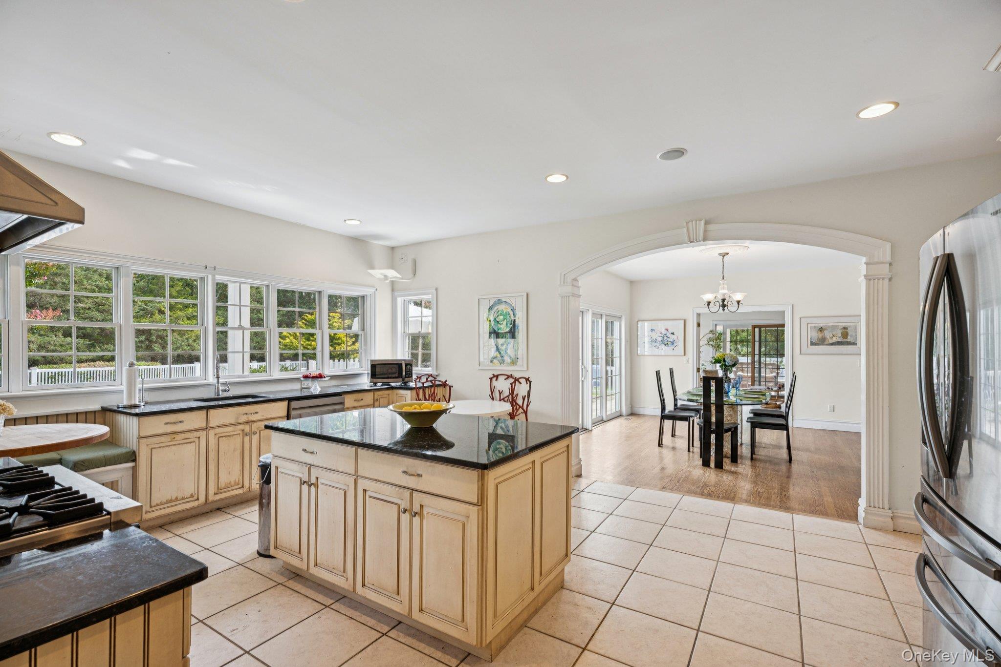 12 Laila Lane Remsenburg, NY 11960 - Photo 18 of 49 a open kitchen with stainless steel appliances granite countertop a sink and cabinets