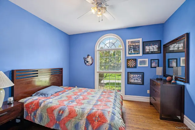 a bedroom with a bed and a bookshelf