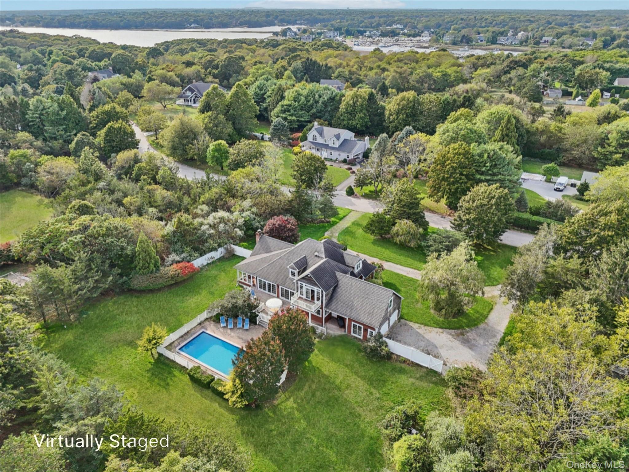 12 Laila Lane Remsenburg, NY 11960 - Photo 2 of 50 an aerial view of a house with a garden