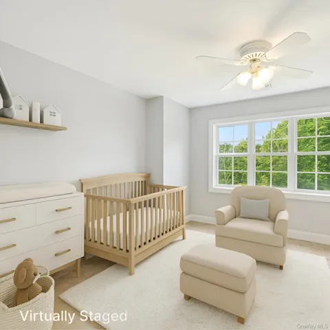 a bedroom with furniture and a window