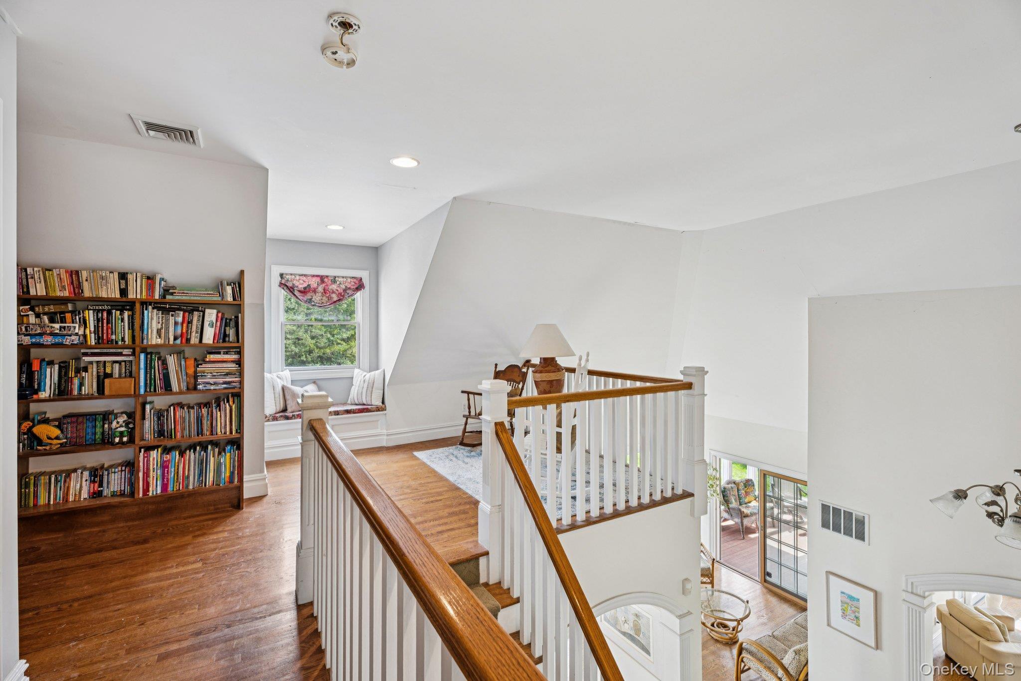 12 Laila Lane Remsenburg, NY 11960 - Photo 28 of 50 a view of a hallway with furniture and wooden floor