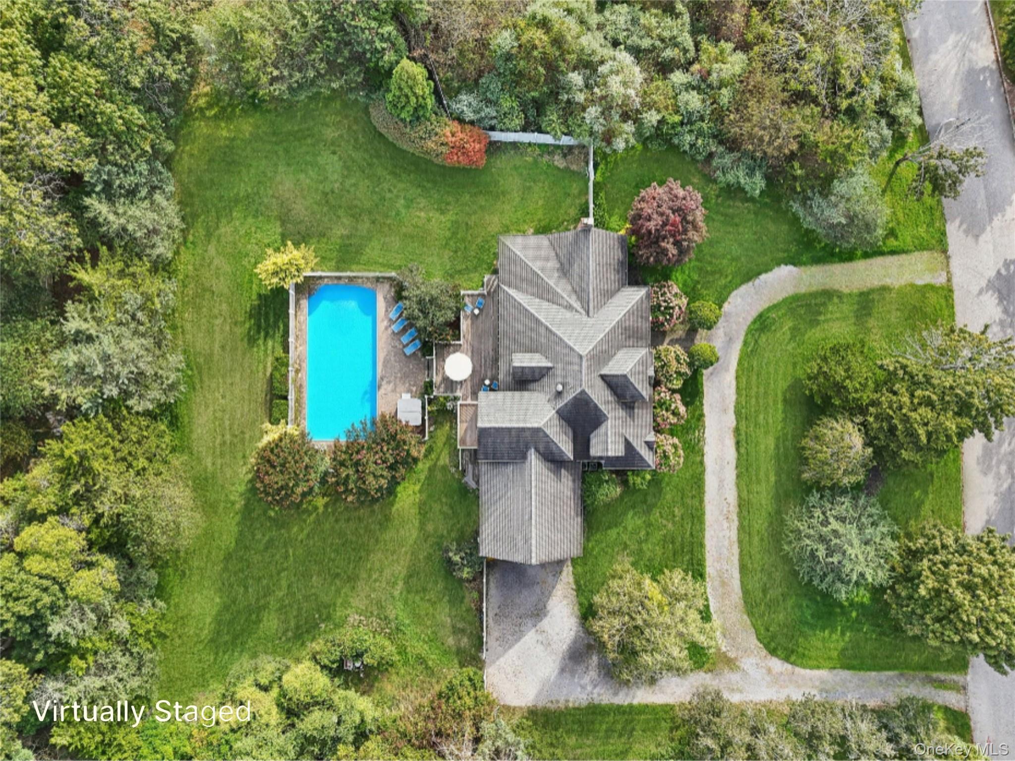 12 Laila Lane Remsenburg, NY 11960 - Photo 3 of 50 A breathtaking aerial view capturing the full scope and beauty of the property. Virtually Staged to show open pool. Virtually Staged to show open pool.