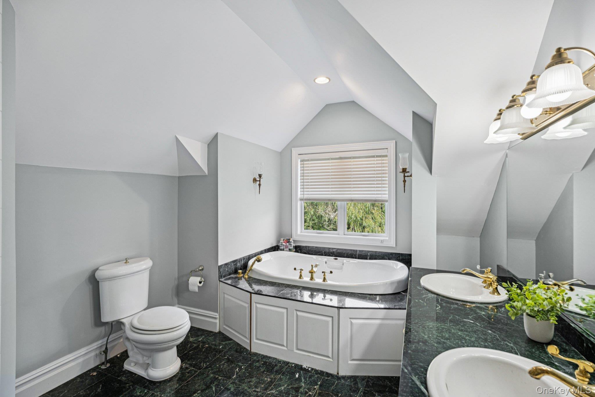 12 Laila Lane Remsenburg, NY 11960 - Photo 31 of 49 a bathroom with a granite countertop toilet sink and mirror