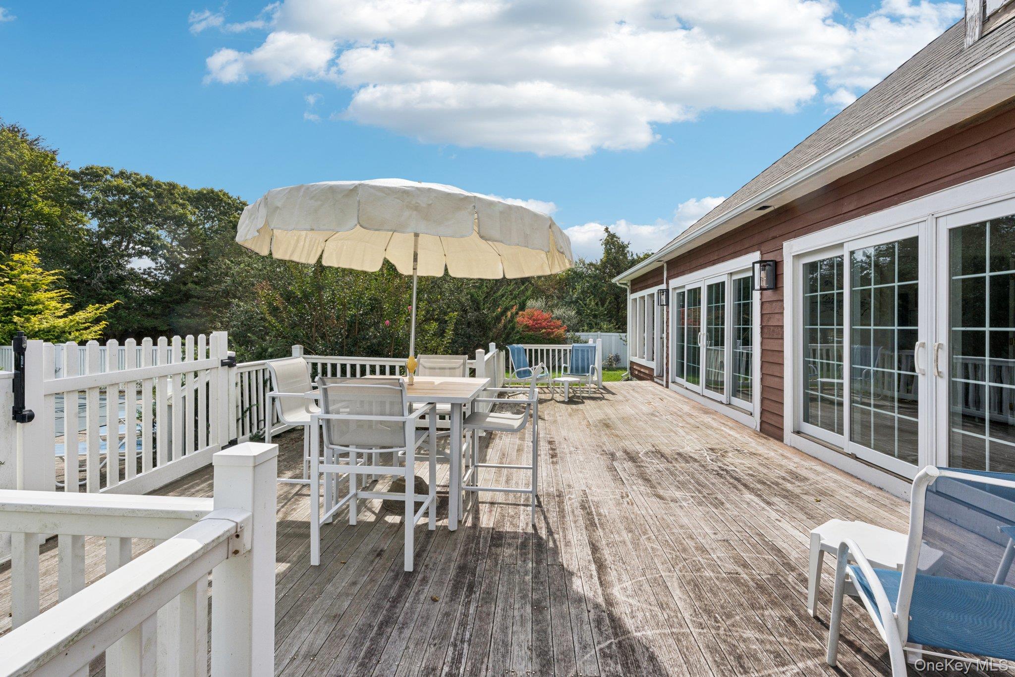 12 Laila Lane Remsenburg, NY 11960 - Photo 36 of 49 a view of a patio with a table and chairs