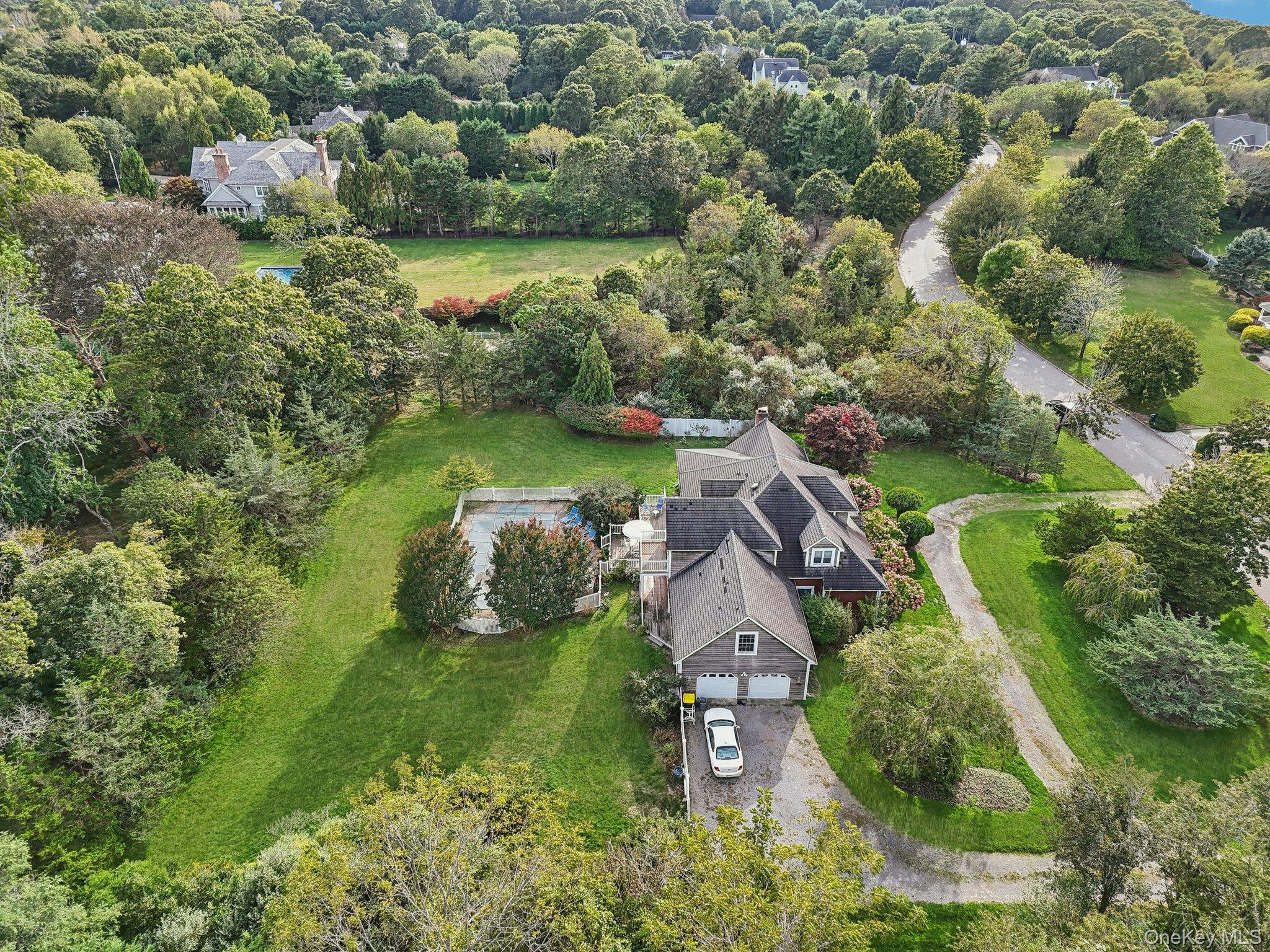 12 Laila Lane Remsenburg, NY 11960 - Photo 44 of 49 an aerial view of a houses with outdoor space and trees all around