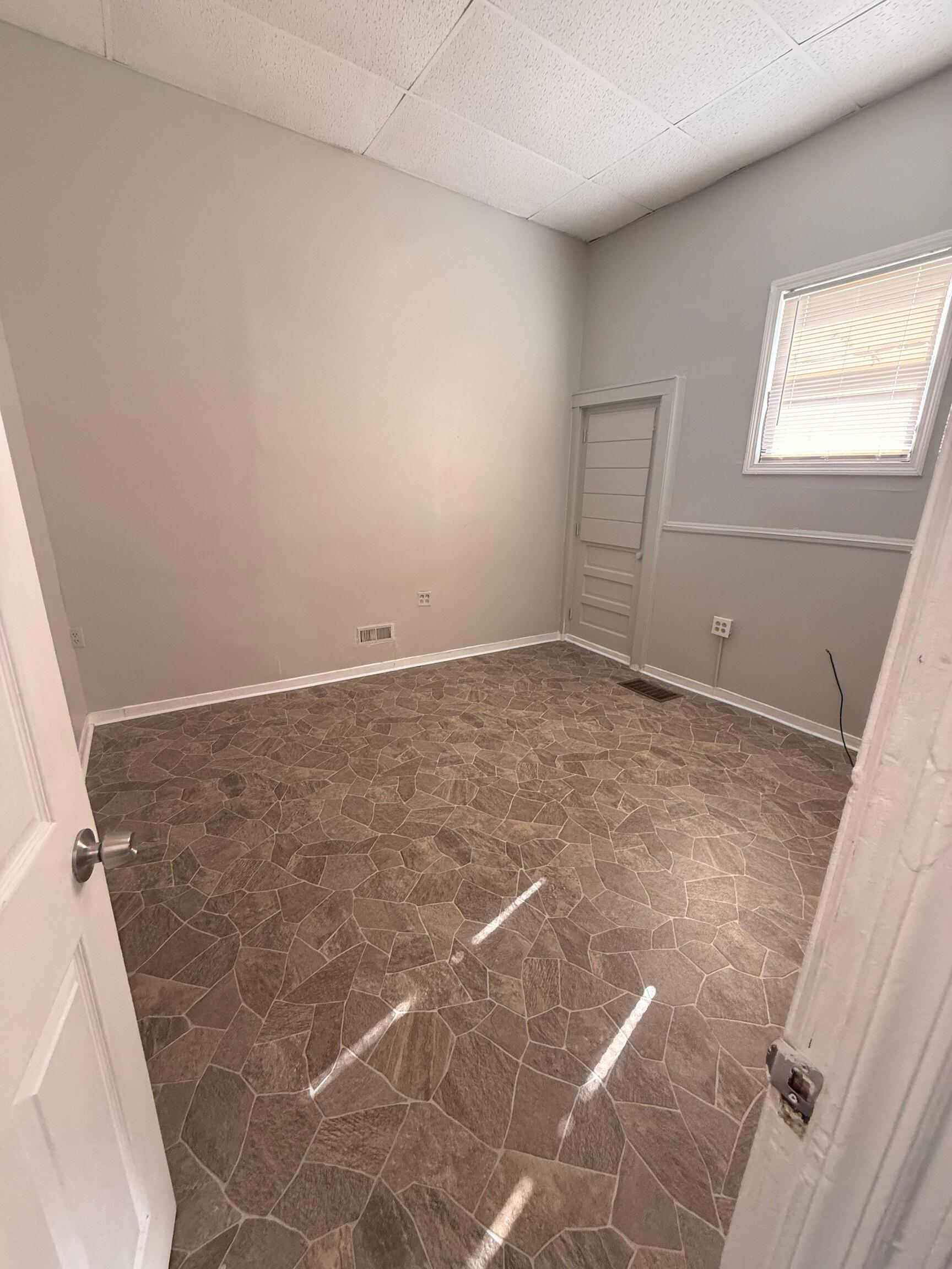 800 Hallett Street, Unit FF1 Bridgeport, CT 06608 - Photo 2 of 6 an empty room with windows