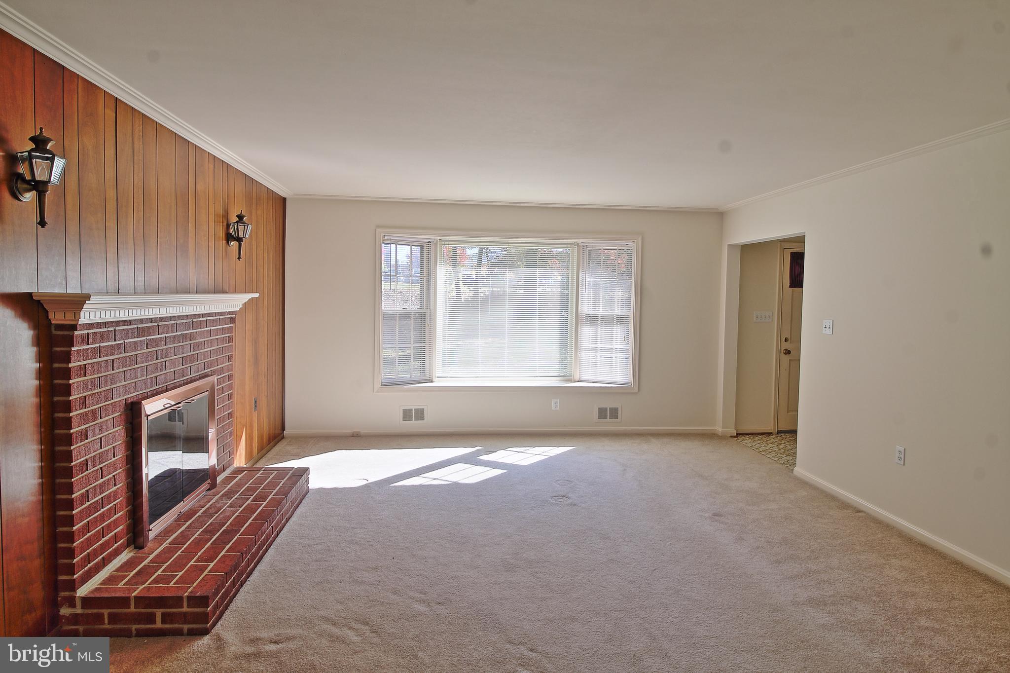 7510 Sanner Road Laurel, MD 20723 - Photo 21 of 36 living room with wood fireplace