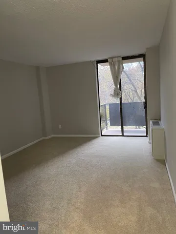 an empty room with a fireplace