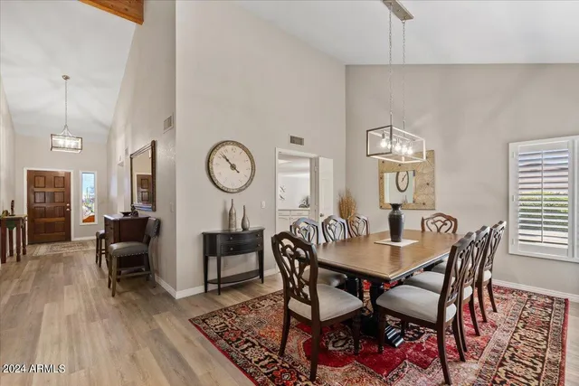 a kitchen with stainless steel appliances a refrigerator sink and cabinets