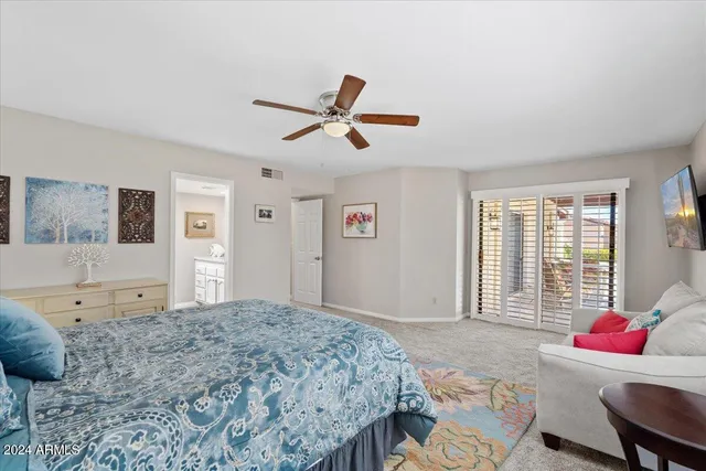 a view of walk in closet and bathroom