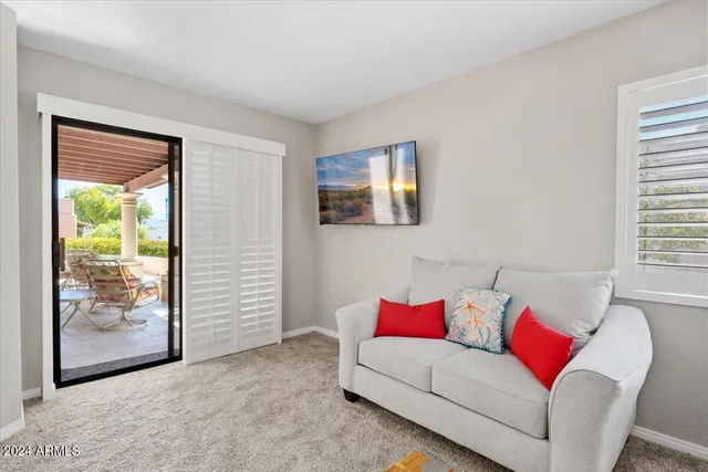 a bedroom with a bed and a couch