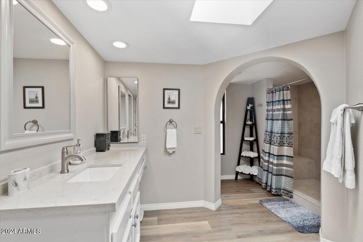 18425 East 4 Peaks Boulevard Rio Verde, AZ 85263 - Photo 26 of 75 a en suite bathroom with a double vanity sink a mirror and shower