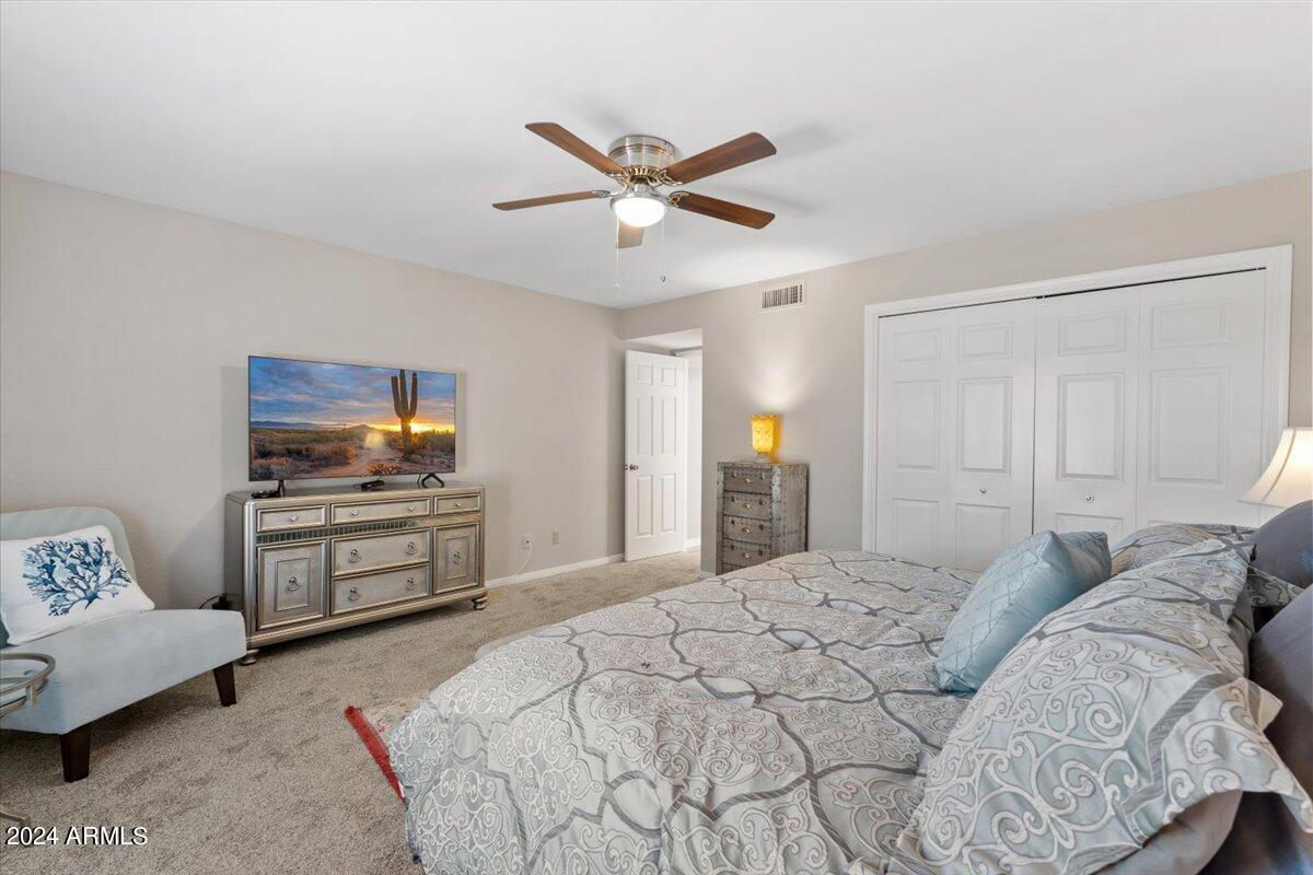 18425 East 4 Peaks Boulevard Rio Verde, AZ 85263 - Photo 30 of 75 a bedroom with a bed and a couch