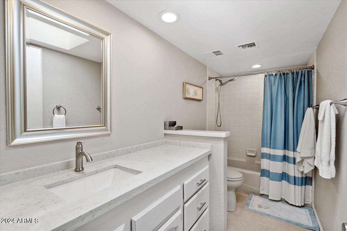 18425 East 4 Peaks Boulevard Rio Verde, AZ 85263 - Photo 33 of 75 a bathroom with a sink vanity mirror and toilet